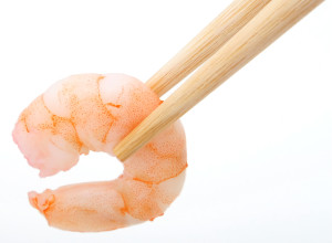 Healthy food, peeled prawn and chop sticks