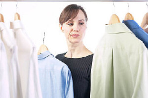 Woman picking out a shirt uid 1343148
